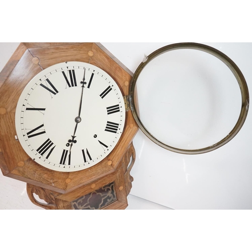 189 - A vintage wooden cased wall clock, white enamel dial with Roman numeral markers.