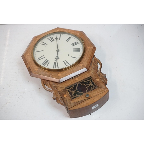 189 - A vintage wooden cased wall clock, white enamel dial with Roman numeral markers.