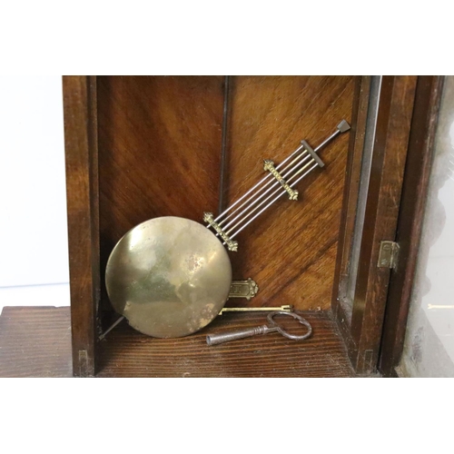 190 - An antique wooden cased wall clock with brass and enamel dial, Roman numeral markers, complete with ... 