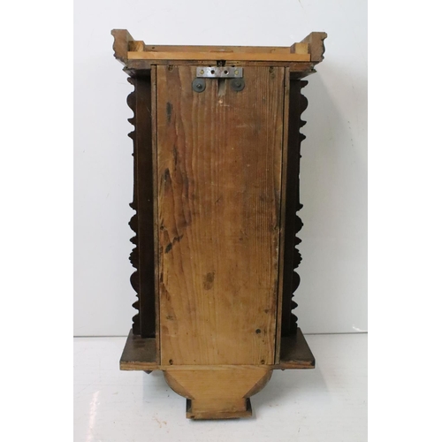 190 - An antique wooden cased wall clock with brass and enamel dial, Roman numeral markers, complete with ... 