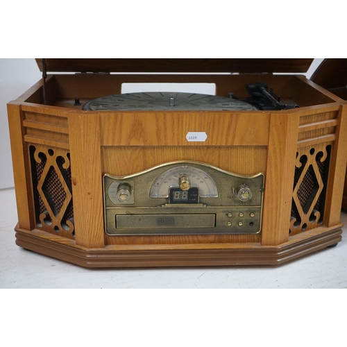 194 - Two vintage style music centres to include record player, CD player, radio and Aux line.