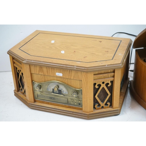 194 - Two vintage style music centres to include record player, CD player, radio and Aux line.