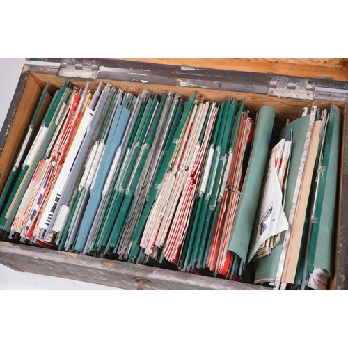 196 - A large collection of Swindon Town football club programmes contained within a large wooden storage ... 