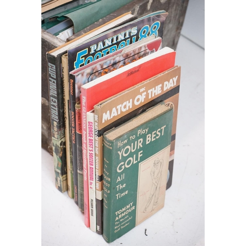 196 - A large collection of Swindon Town football club programmes contained within a large wooden storage ... 