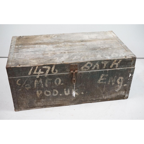 196 - A large collection of Swindon Town football club programmes contained within a large wooden storage ... 