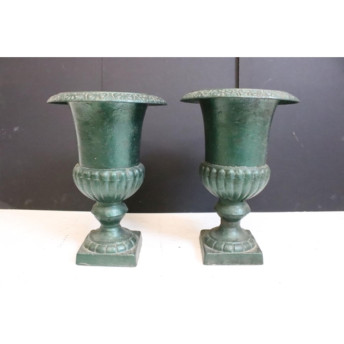 199 - Pair of cast iron urn planters of classic form, approx 34cm high