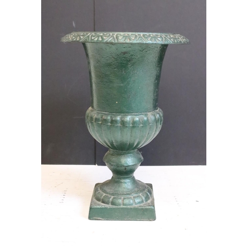199 - Pair of cast iron urn planters of classic form, approx 34cm high