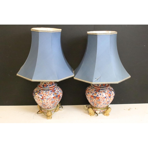 200 - Pair of Chinese Imari table lamps of shouldered form, the floral & foliate decoration with gilt deta... 