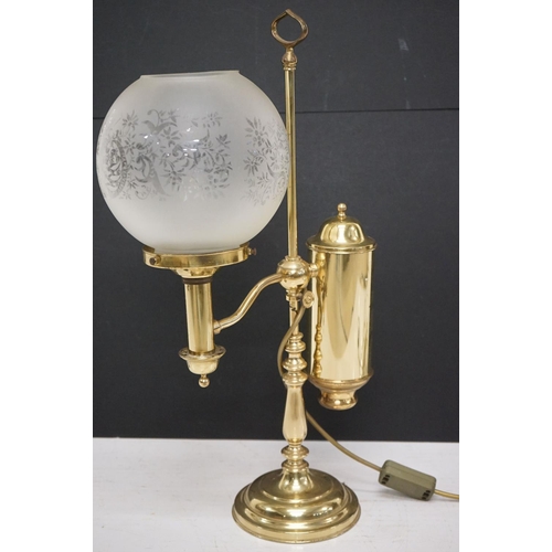 202 - Brass table lamp, the globular shade of etched design, 57.5cm high
