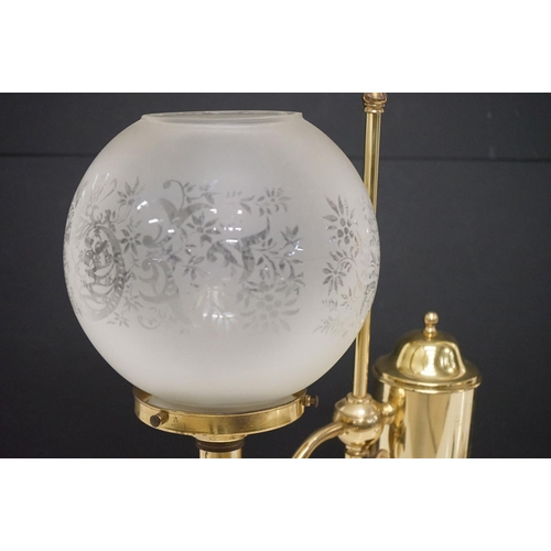 202 - Brass table lamp, the globular shade of etched design, 57.5cm high