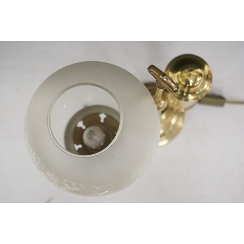 202 - Brass table lamp, the globular shade of etched design, 57.5cm high