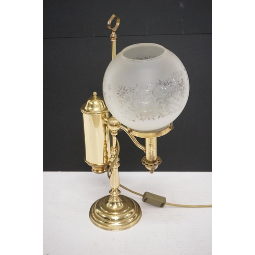 202 - Brass table lamp, the globular shade of etched design, 57.5cm high