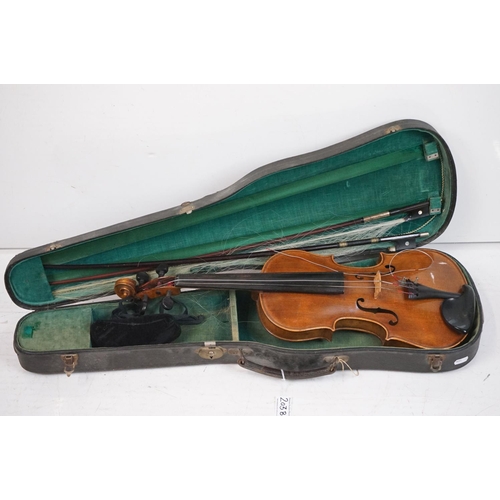 203B - A violin together with two violin bows, cased, label suggests this was possibly the property of Fran... 