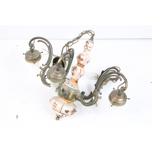 205 - Wrought iron basket on a hinged bracket, decorated with a scrolling design and a flower, impressed '... 