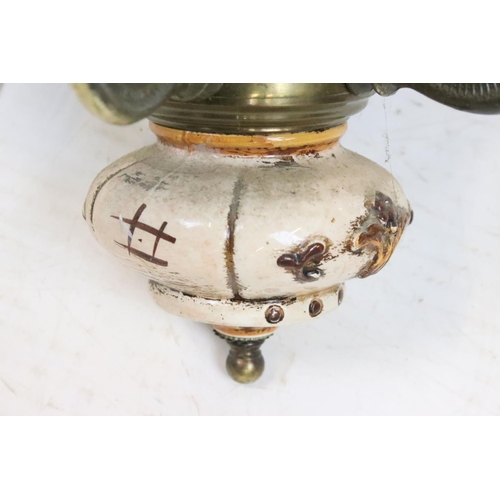 205 - Wrought iron basket on a hinged bracket, decorated with a scrolling design and a flower, impressed '... 