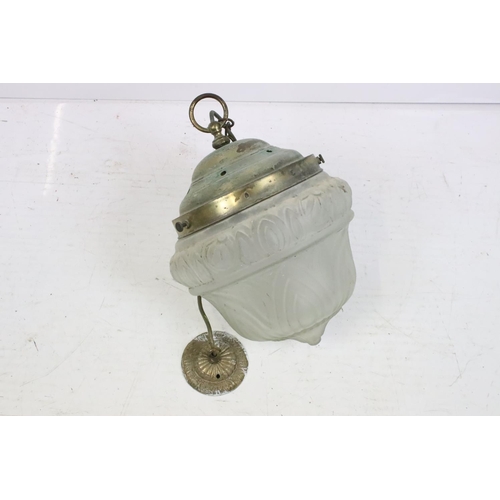 205 - Wrought iron basket on a hinged bracket, decorated with a scrolling design and a flower, impressed '... 