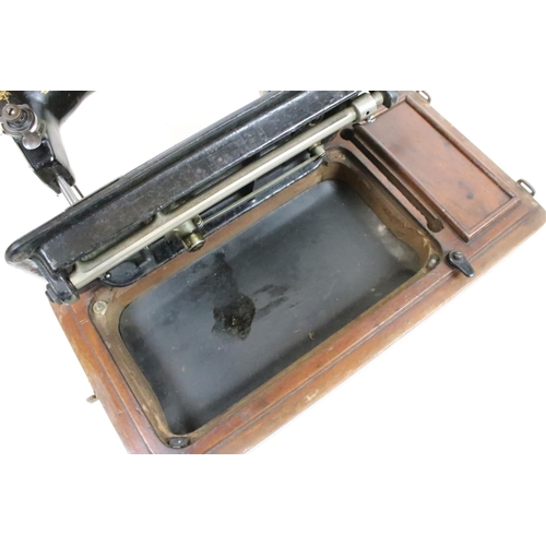 206 - Singer sewing machine, cased together with another sewing machine, cased, with a plaque ' A. W. Spen... 