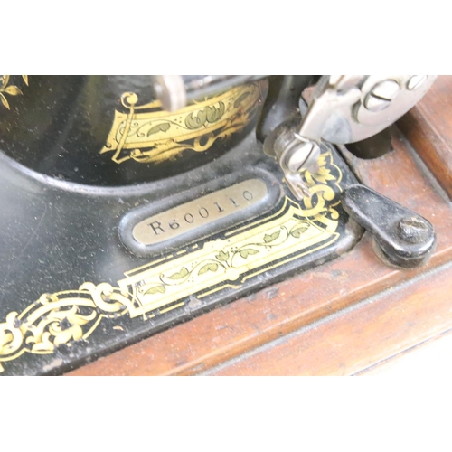206 - Singer sewing machine, cased together with another sewing machine, cased, with a plaque ' A. W. Spen... 