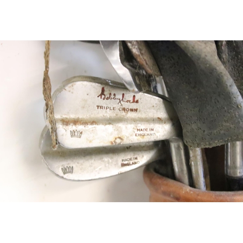 216 - Collection of golf clubs, within a canvas and leather bag, to include many Bobby Locke Triple Crown ... 