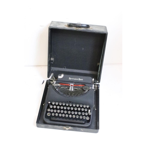 218 - Three typewriters, comprising: a Burroughs, an Olympia, cased and a Remington Rand, cased