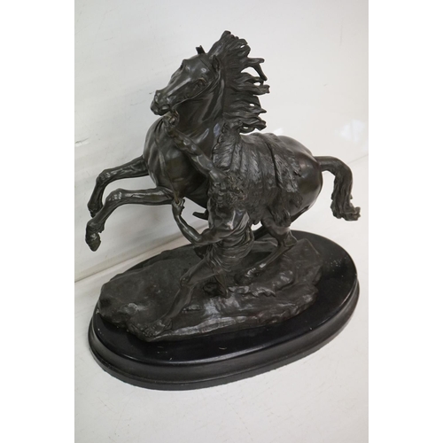 24 - After Guillaume Coustou I - A pair of patinated bronze ' Marley Horse ' sculptures featuring rearing... 