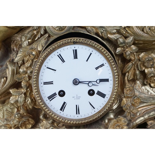 26 - 19th Century gilt metal mantle clock having a central white enamelled face with roman numerals to th... 