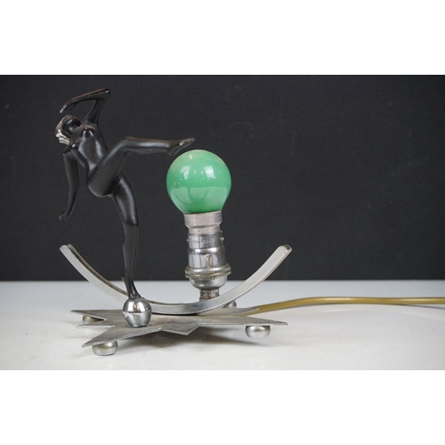 28 - Art Deco wall lamp having a star shaped back plate with a nude female figure and green light bulb. B... 