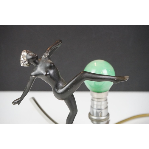 28 - Art Deco wall lamp having a star shaped back plate with a nude female figure and green light bulb. B... 