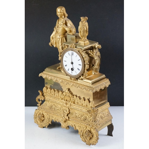 32 - 19th Century French gilt mantle clock having a gilt male figure to the top beside a white enamelled ... 