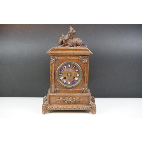 4 - 19th Century Victorian carved black forest mantle clock featuring carved rabbits to the top, and blu... 