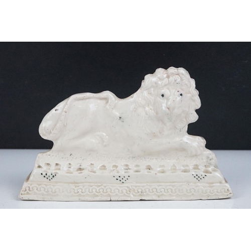 43 - Early 20th Century ceramic lion flat back figurine, depicted crouched on a moulded base. Signed Lily... 