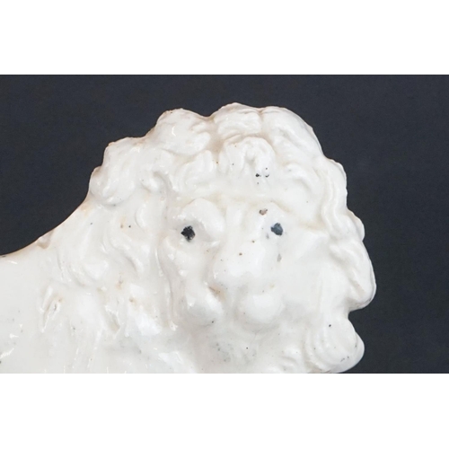 43 - Early 20th Century ceramic lion flat back figurine, depicted crouched on a moulded base. Signed Lily... 