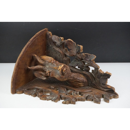 5 - Late 19th Century Victorian carved black forest corner shelf. The shelf having a carved deer bust fl... 