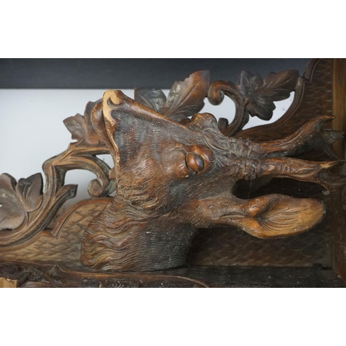 5 - Late 19th Century Victorian carved black forest corner shelf. The shelf having a carved deer bust fl... 