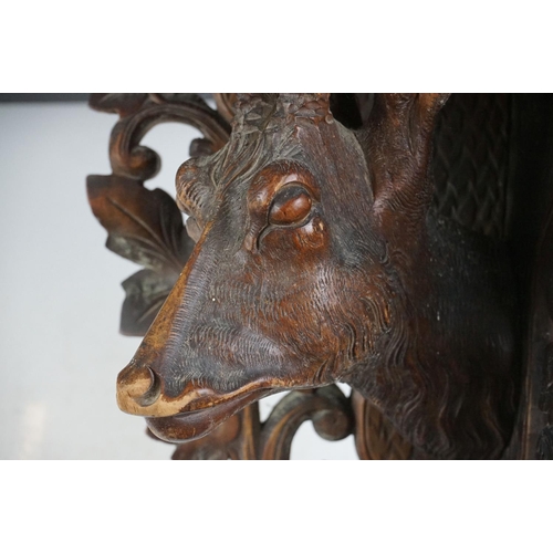 5 - Late 19th Century Victorian carved black forest corner shelf. The shelf having a carved deer bust fl... 