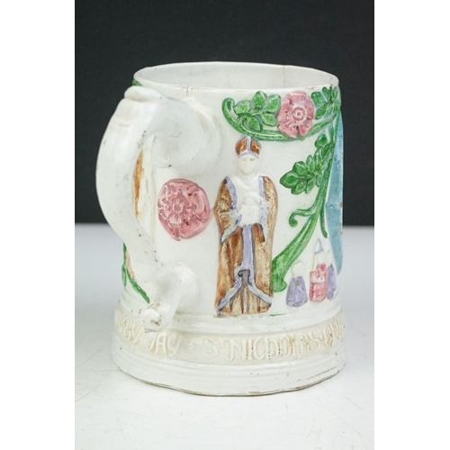 54 - 19th Century Victorian Compton Pottery mug decorated in relief with figures and foliate patterns, wi... 