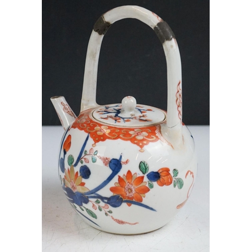 60 - Japanese Imari teapot & cover with high loop handle and floral decoration (approx 18cm high), togeth... 