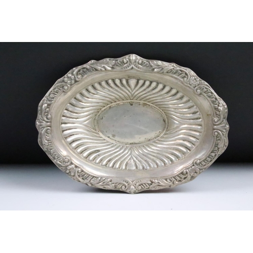 85 - A fully hallmarked sterling silver dish with traditional decoration, assay marked for Sheffield and ... 