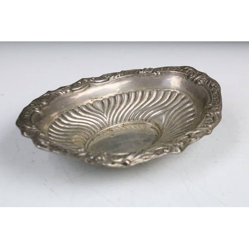 85 - A fully hallmarked sterling silver dish with traditional decoration, assay marked for Sheffield and ... 