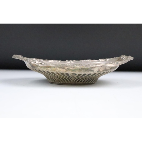 85 - A fully hallmarked sterling silver dish with traditional decoration, assay marked for Sheffield and ... 