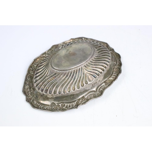 85 - A fully hallmarked sterling silver dish with traditional decoration, assay marked for Sheffield and ... 