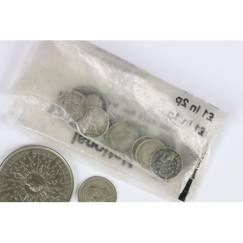 599 - A small collection of British coins and banknotes to include two white £5 notes and a small quantity... 