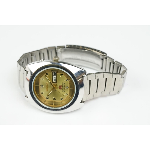 264 - Ricoh Automatic stainless steel gents wristwatch, date aperture, gold-coloured dial, Arabic numerals... 