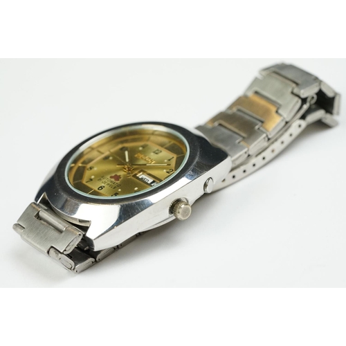 264 - Ricoh Automatic stainless steel gents wristwatch, date aperture, gold-coloured dial, Arabic numerals... 