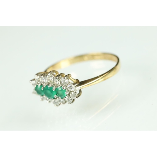 209 - Emerald and cubic zirconia 9ct yellow gold and white gold set ring, three graduated round mixed cut ... 