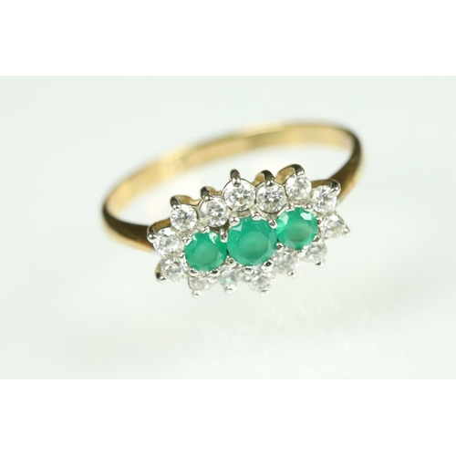 209 - Emerald and cubic zirconia 9ct yellow gold and white gold set ring, three graduated round mixed cut ... 