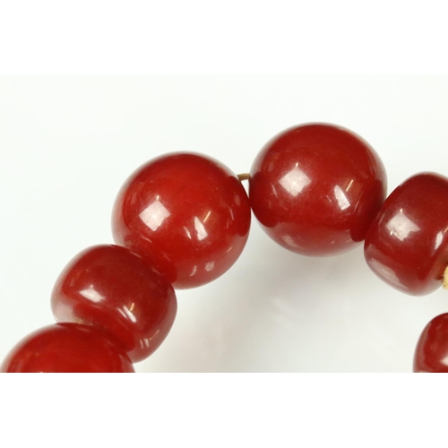 24 - Cherry amber Bakelite necklace, circular and flatten circular beads, dimensions approx 20 x 20mm and... 