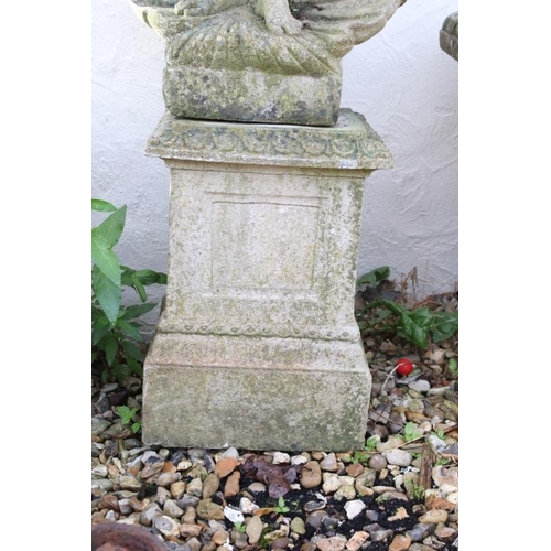 272 - Reconstituted stone statue of a nude maiden stood upon a shell, raised on a square pedestal base. Me... 