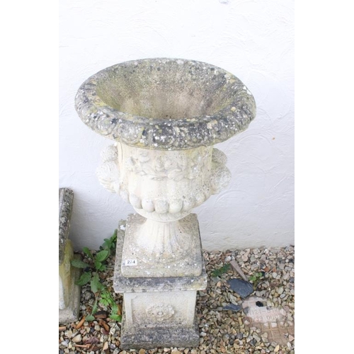274 - Pair of reconstituted stone garden urns of campana form, with relief facial mask decoration and gadr... 