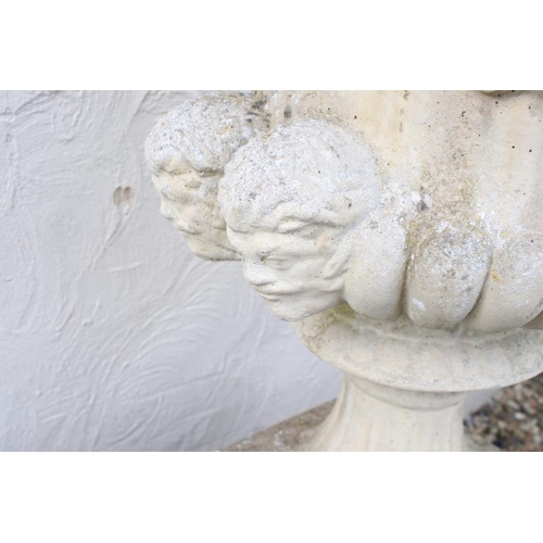274 - Pair of reconstituted stone garden urns of campana form, with relief facial mask decoration and gadr... 